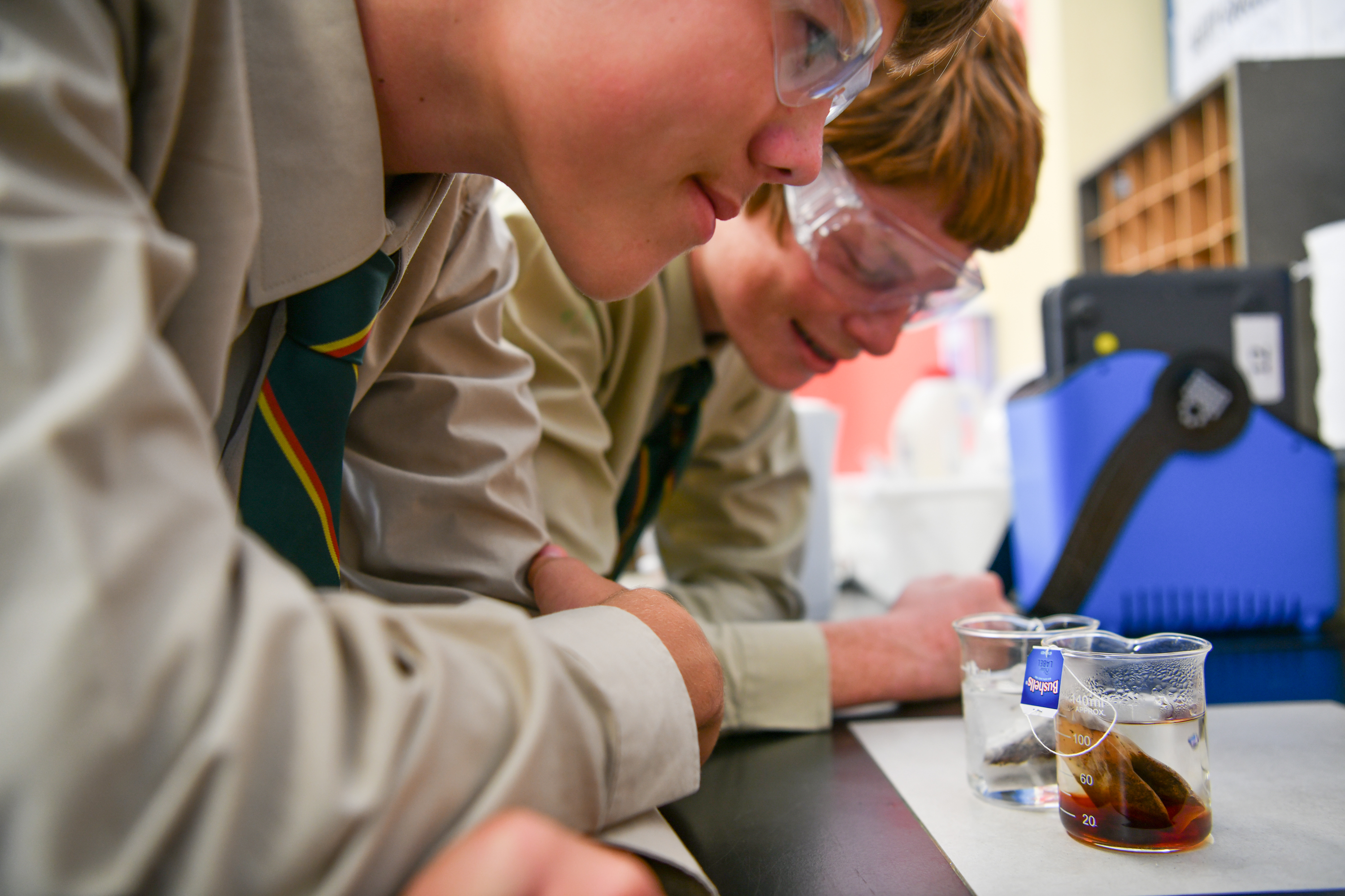 Staff writing in science lab
