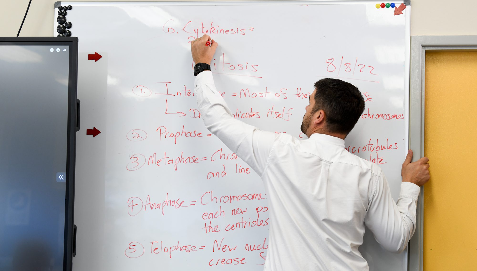 Staff writing in science lab